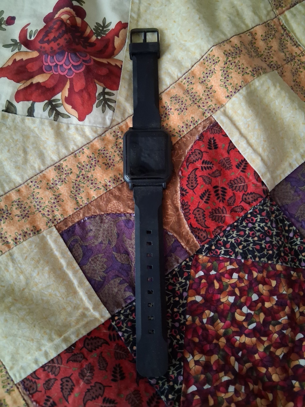Black Smartwatch with Silicone Band and Touchscreen Display